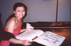 Sha signing the book at Carnegie Hall